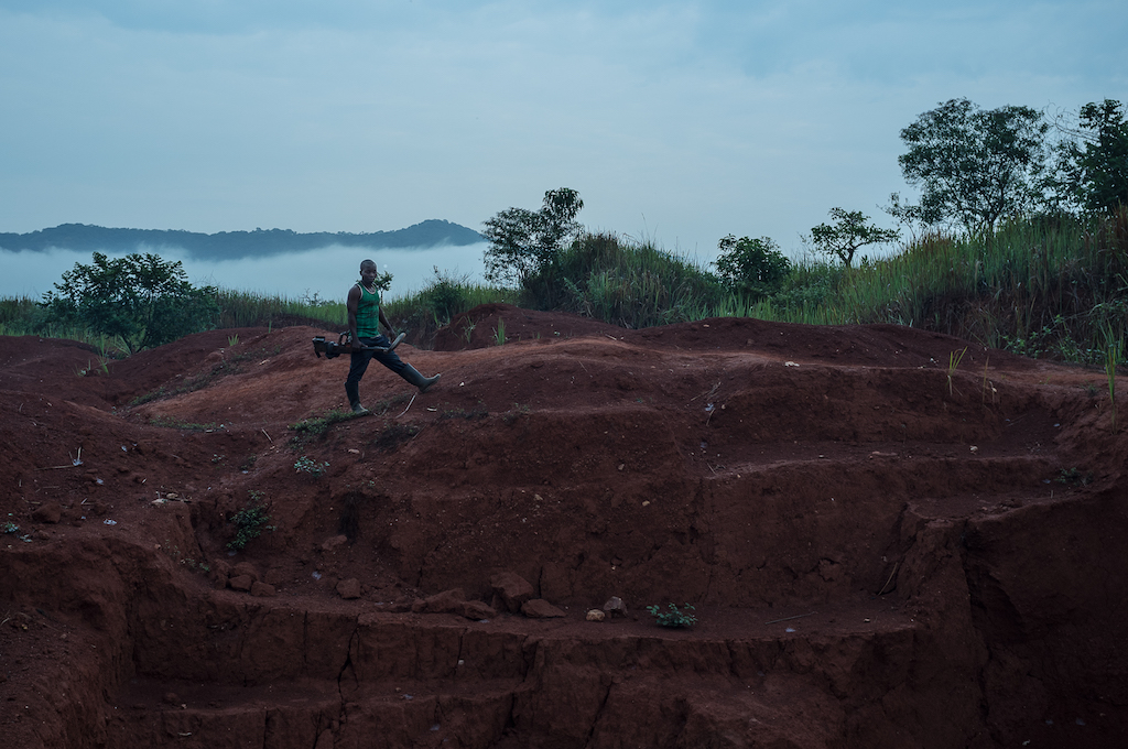 Miner with a metal detector near the Kamoko gold mine in DRC